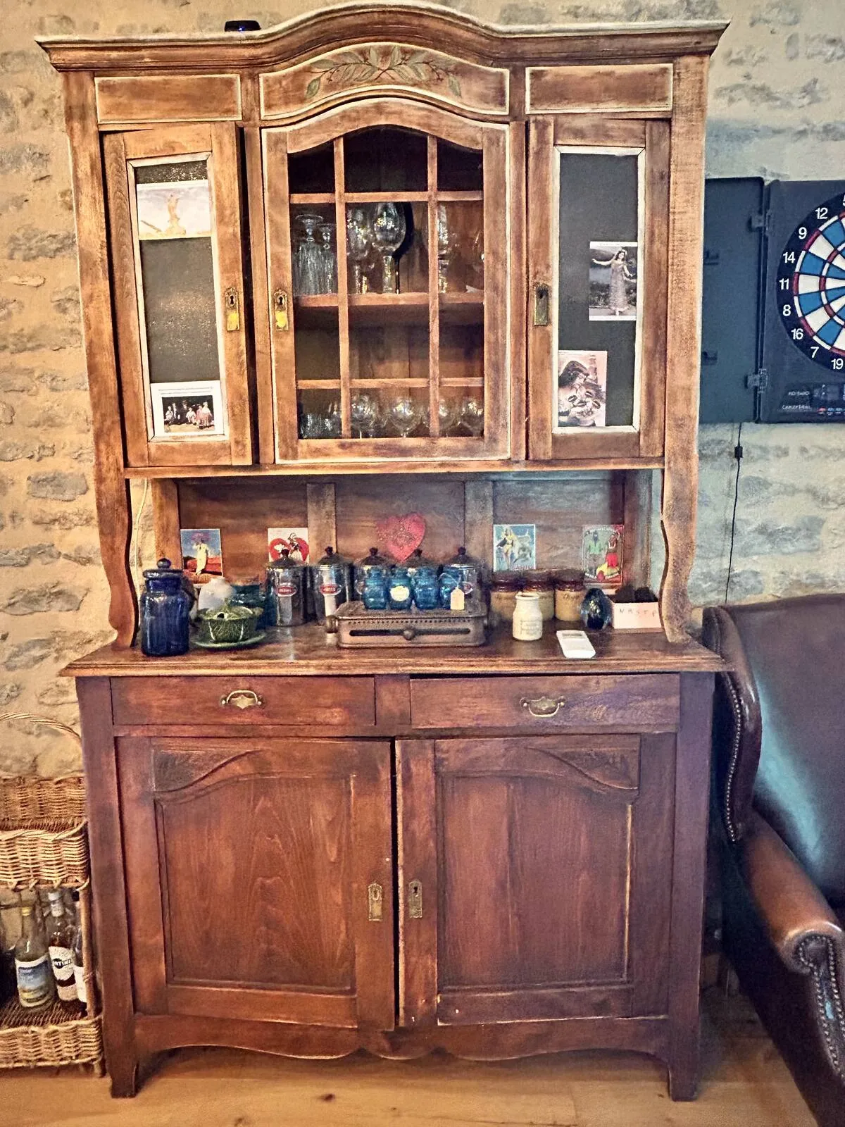 Antique sideboard and decor on a brick wall