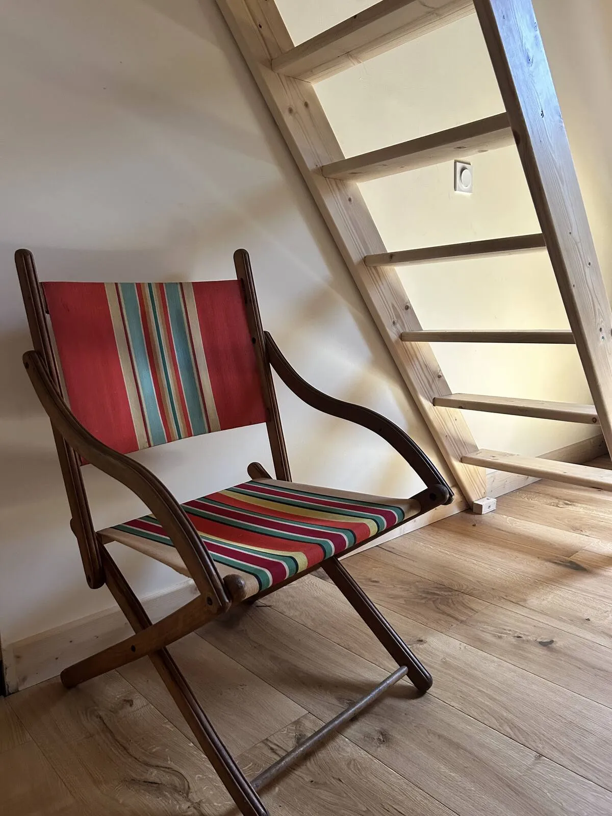 Folding deck chair under the eaves