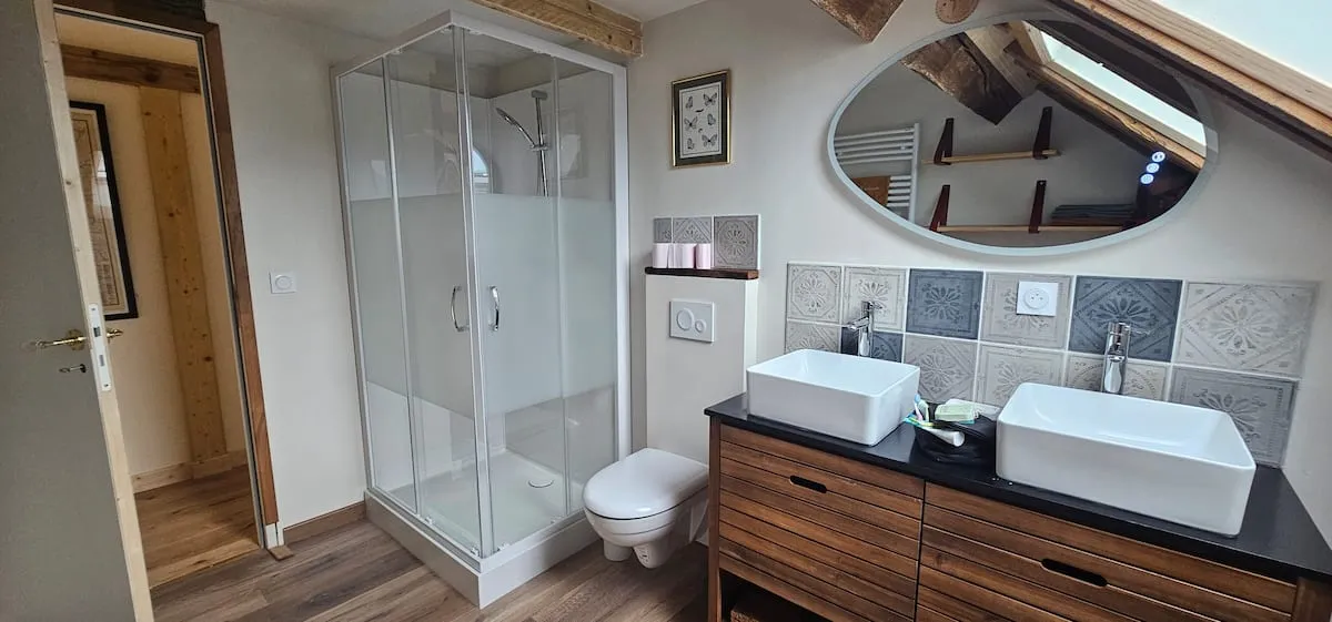 Bathroom with double sink and shower