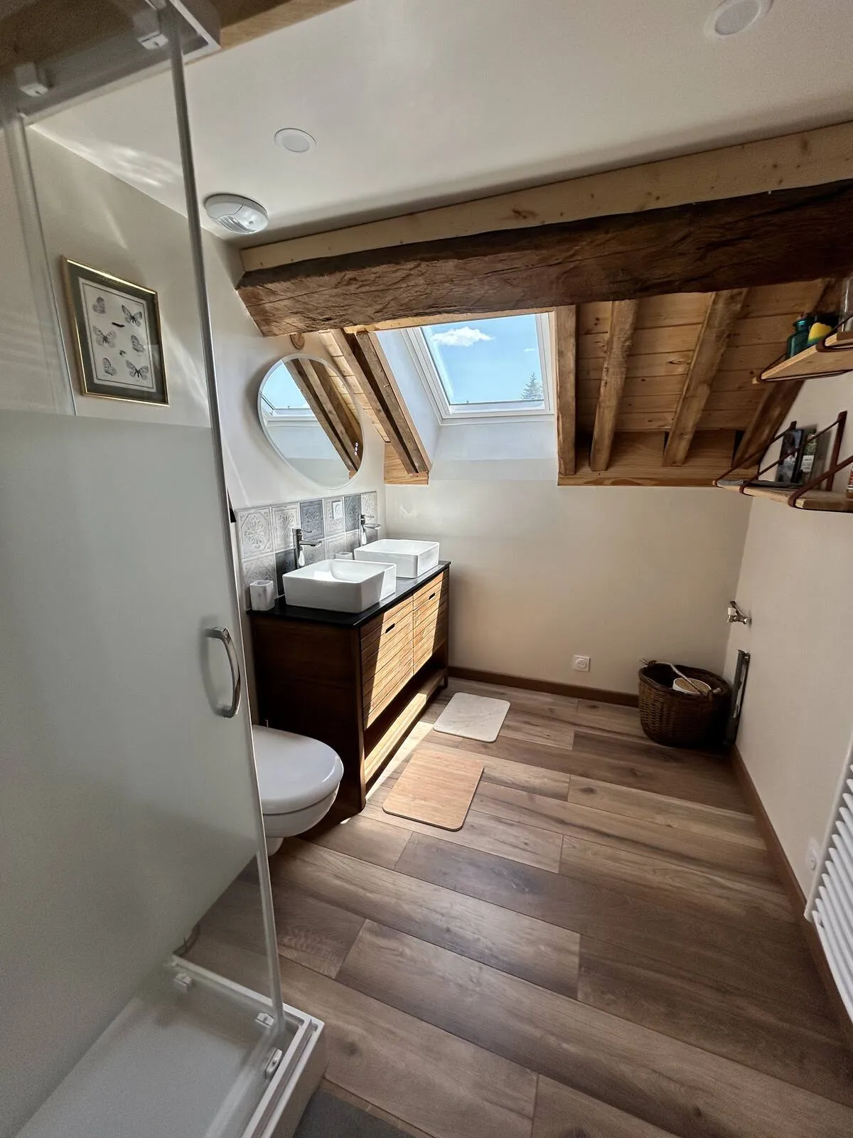 Bathroom with sink, mirror and wooden floor