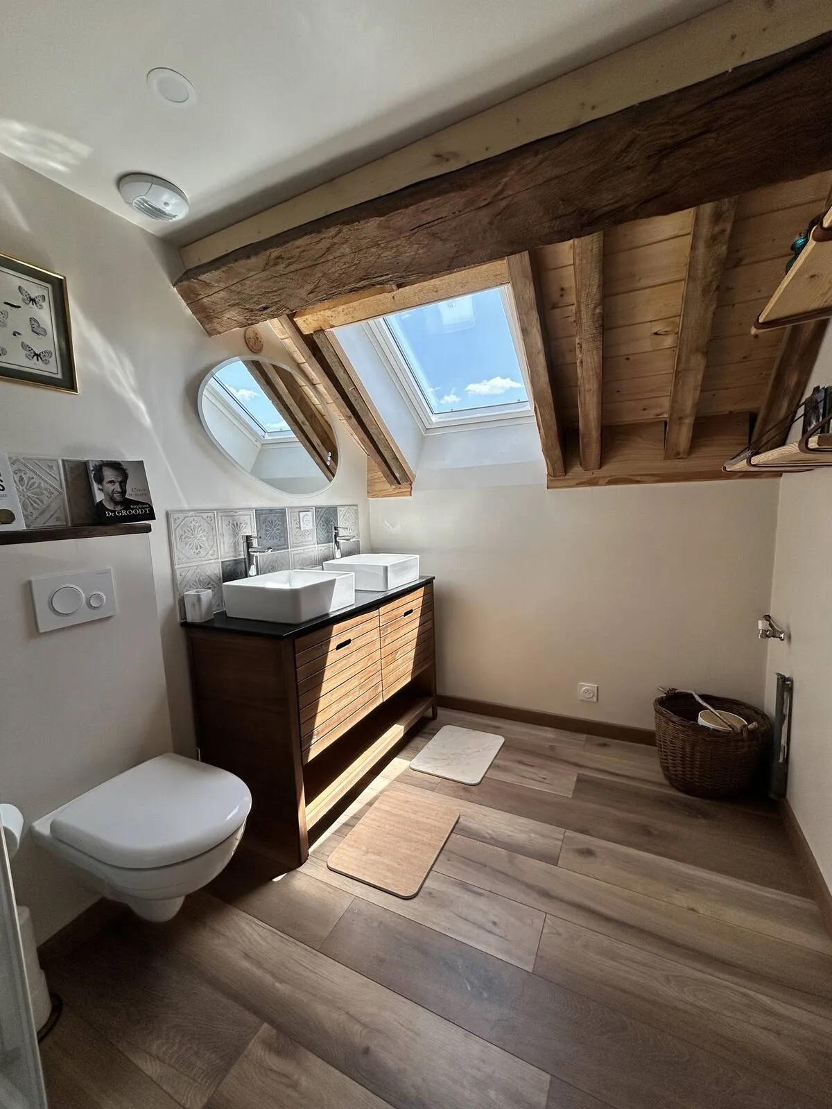Bathroom with sink and toilet, wooden floor