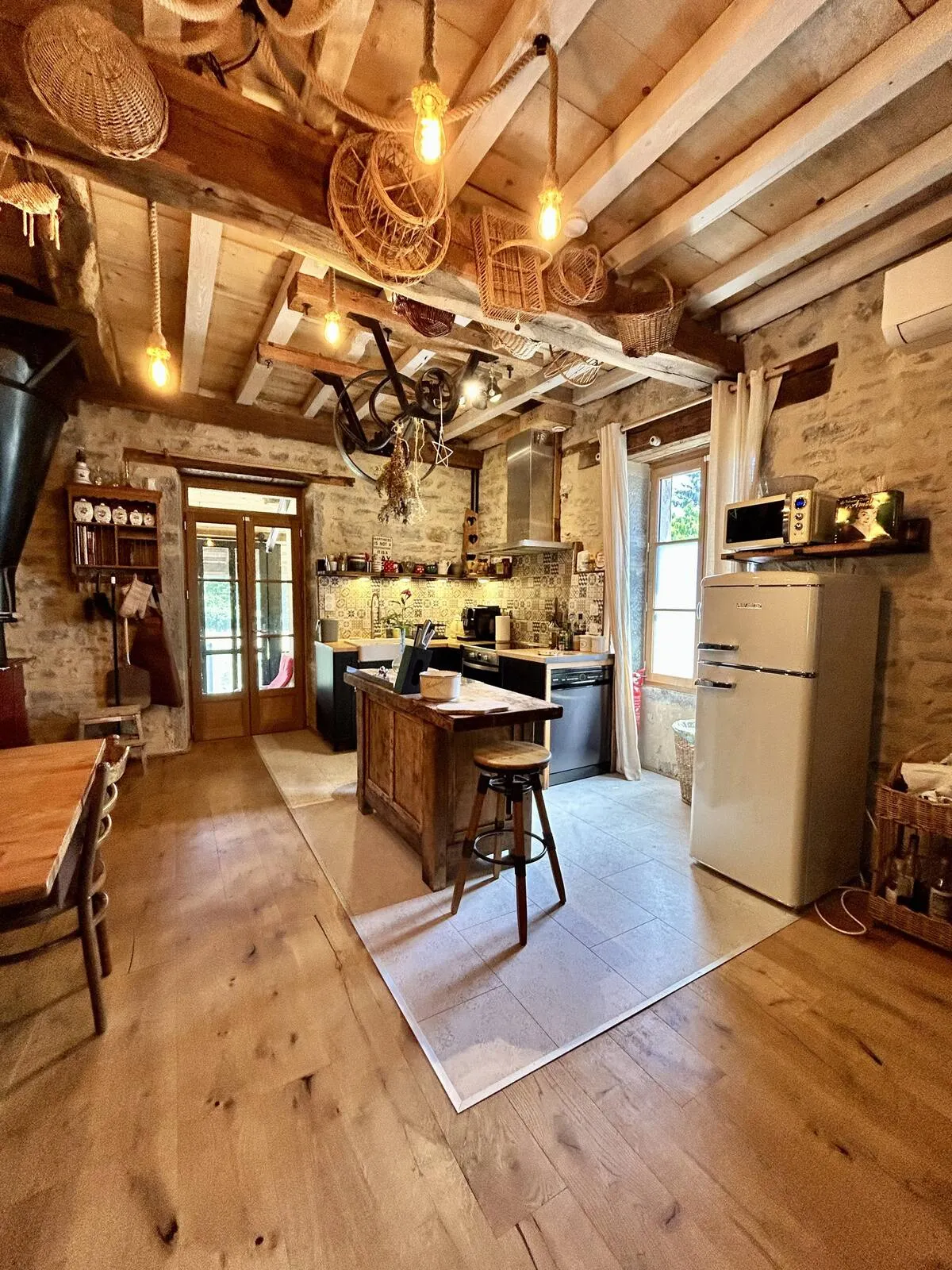 Living room with exposed beams and old wooden floor
