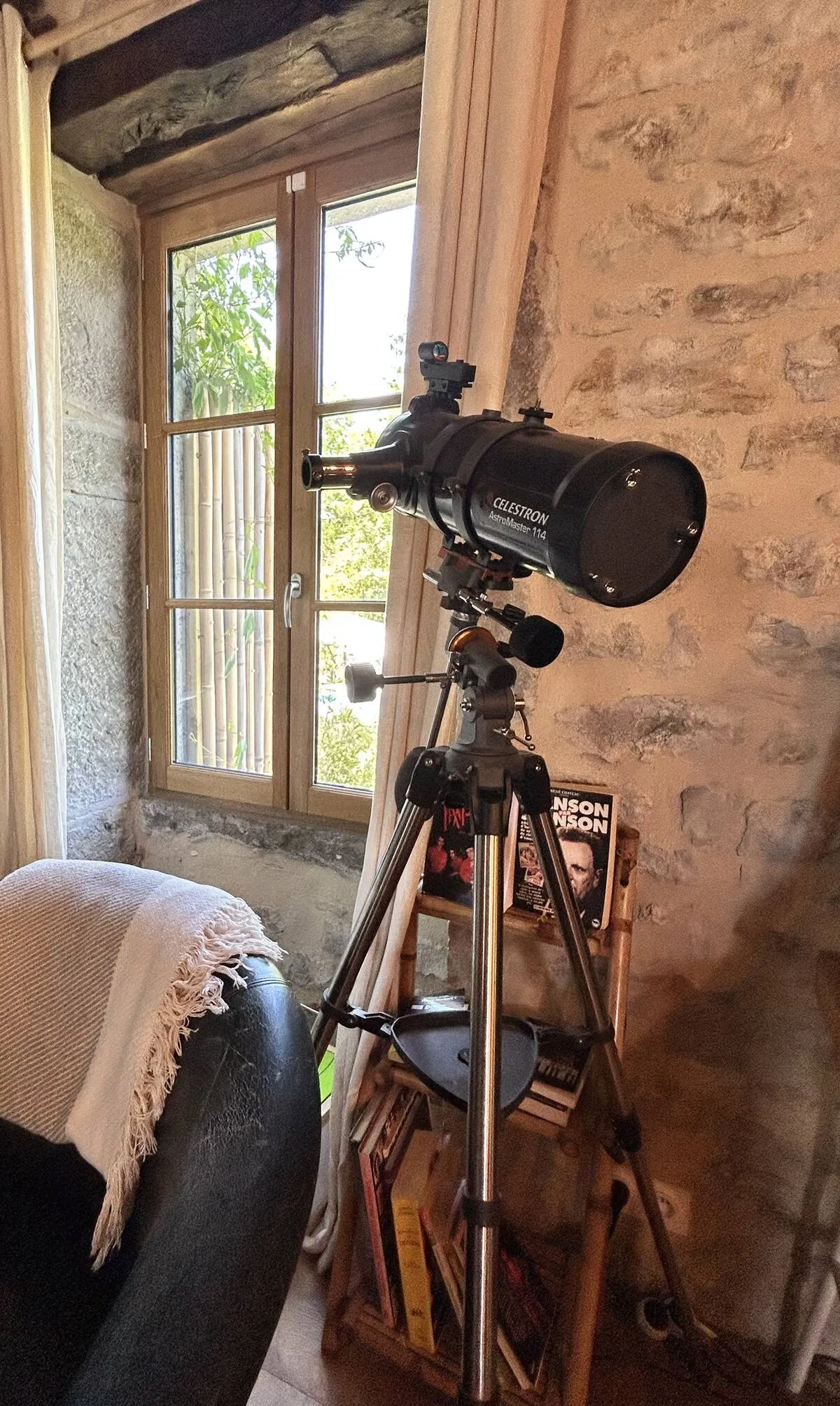 Telescope by a window